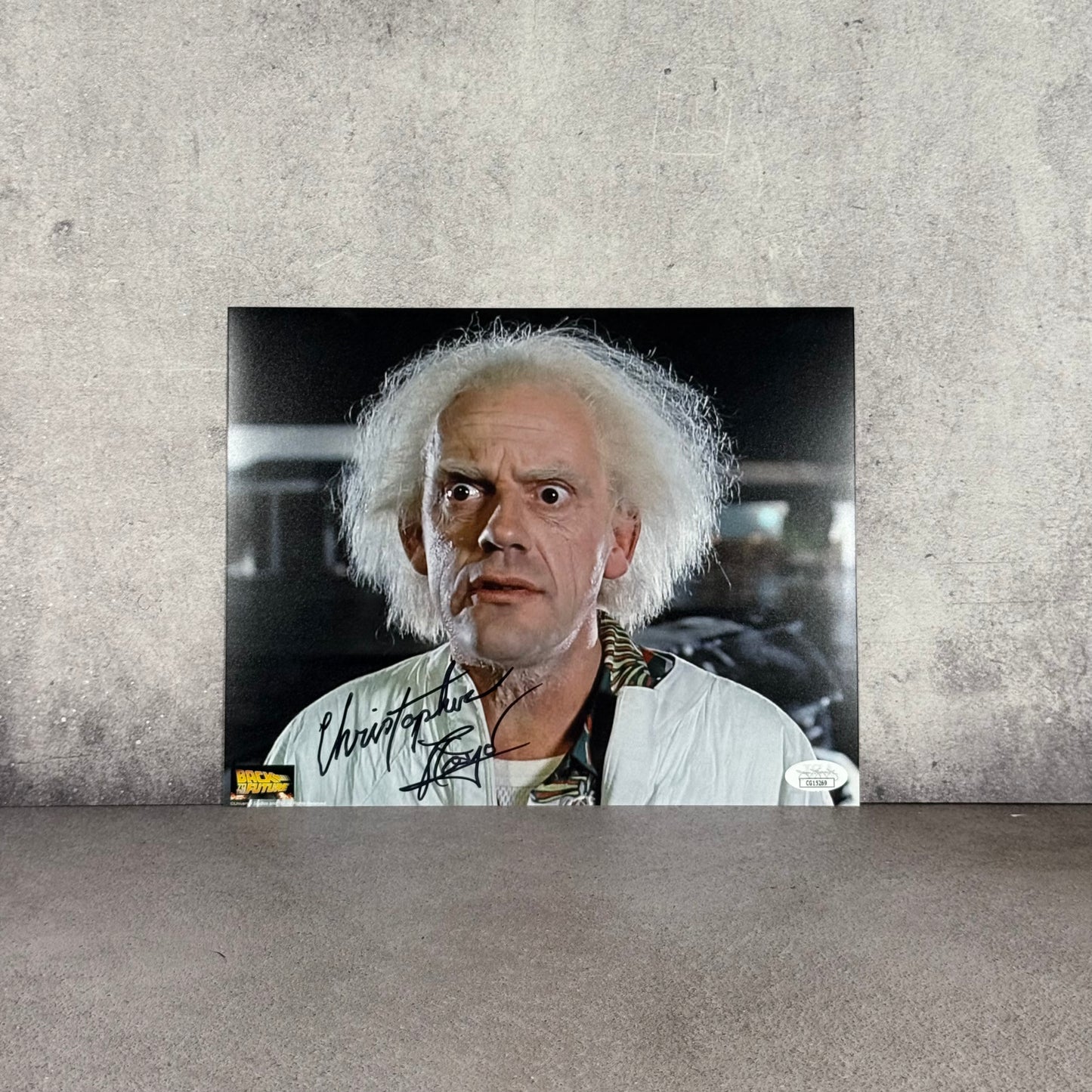 Foto Dr Emmett Brown firmada por Chistopher Lloyd